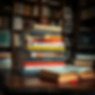 A stack of influential books on a wooden desk